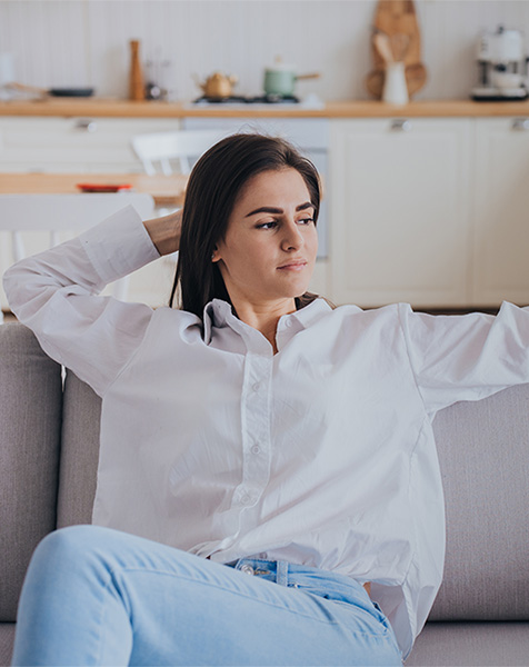 Woman relaxing comfortably with improved indoor air quality by Airtech in Livonia, MI